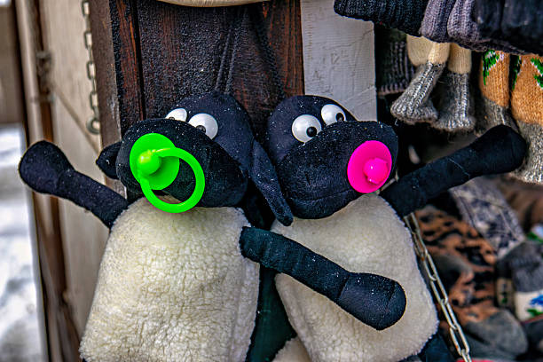 A couple of stuffed animals that are hanging on a wall