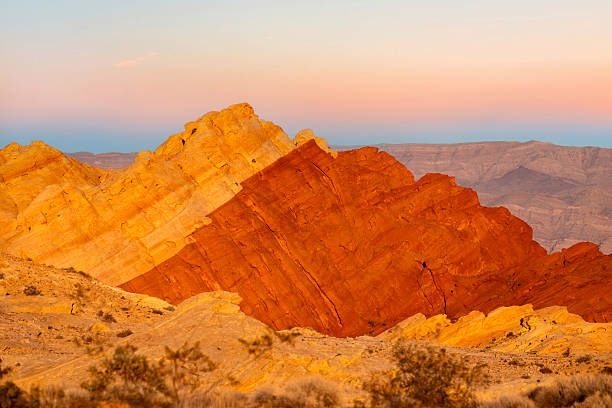 As daylight fades over Valley of Fire State Park, the park’s red sandstone formations glow beneath a cotton-candy sky of pinks, blues, and soft violets. The brief blue hour softens the desert landscape, balancing warm stone against cool twilight hues. The scene captured the quiet transition between day and night in one of Nevada’s most striking desert environments.