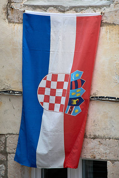 istock Croatian flag hanging on a stone wall 2247832542