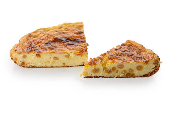 istock Two slices of cottage cheese raisin pie on white 2247832882