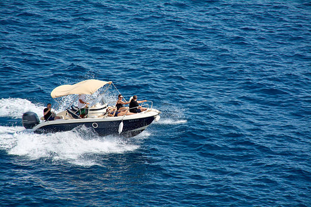 A motorboat makes circles over the deep blue sea on Mallorca in Spain.