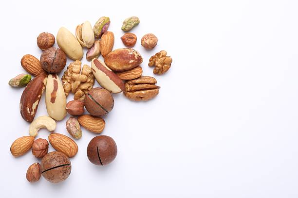 istock Mix of different nuts on white background, flat lay. Space for text 2247833068