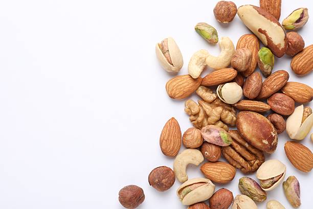 istock Mix of different nuts on white background, flat lay. Space for text 2247833099