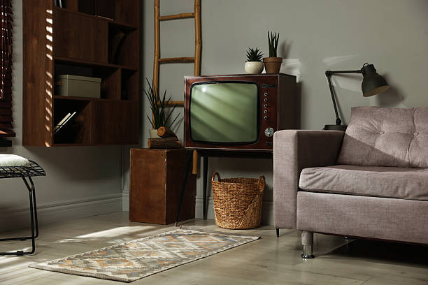 istock Soft sofa, retro TV set and other used stuff indoors 2247833204