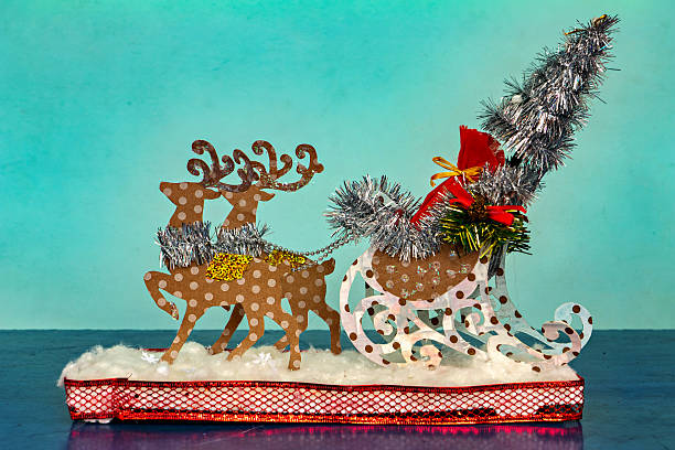 istock A whimsical Christmas tree decorated with a reindeer a sled and a silver tinsel 2247833863