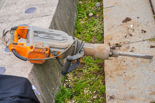 Electric Jackhammer on Concrete Surface Outdoors. High quality photo