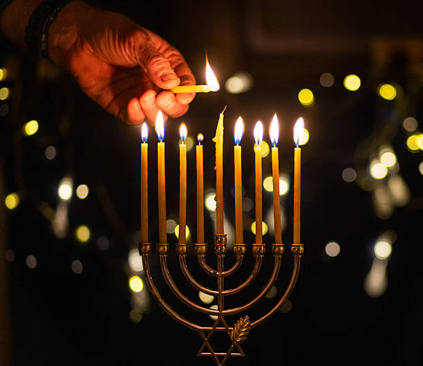 istock hanukkah Menorah - Candles With Glittering And David Stars 2247839776