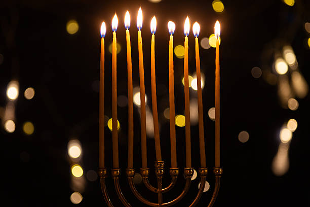 istock hanukkah Menorah - Candles With Glittering And David Stars 2247839801