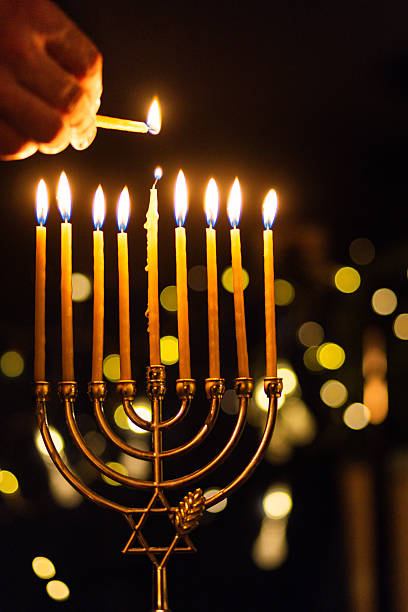 istock hanukkah Menorah - Candles With Glittering And David Stars 2247839818