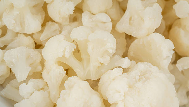 istock Steamed cauliflower pieces close up 2247841706