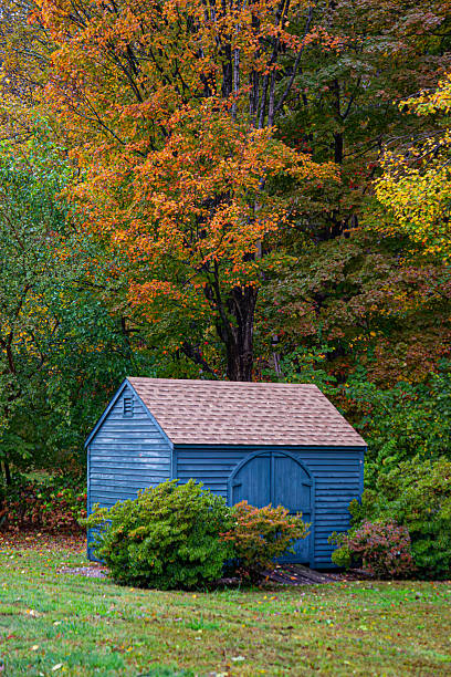 istock A small rustic blue shed stands before a hill covered in beautiful autumn fall colors, East Haddam, Connecticut 2247842437