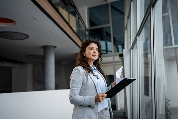 istock Businesswoman thinking, planning in modern corporate office 2247843603