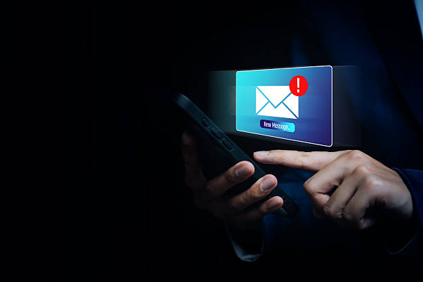 istock Hand tapping phone with message alert icon, digital warning awareness, cyber communication risk, notification caution mindset, online safety insight, urgent message concept 2247845829