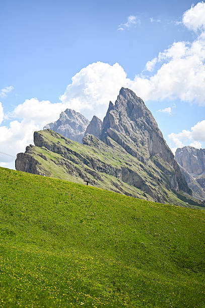 istock Seceda dolomites landscape with green mountain pasture and hiker 2247850246