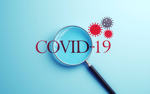 3d render Covid-19 Text Selected with Metallic Magnifying Glass on Soft Blue Background, Medical and Health Concept
