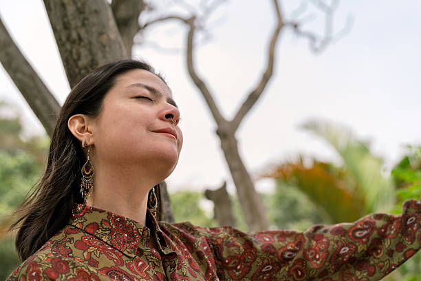 istock Young woman taking a deep breath relaxing in nature 2247853468
