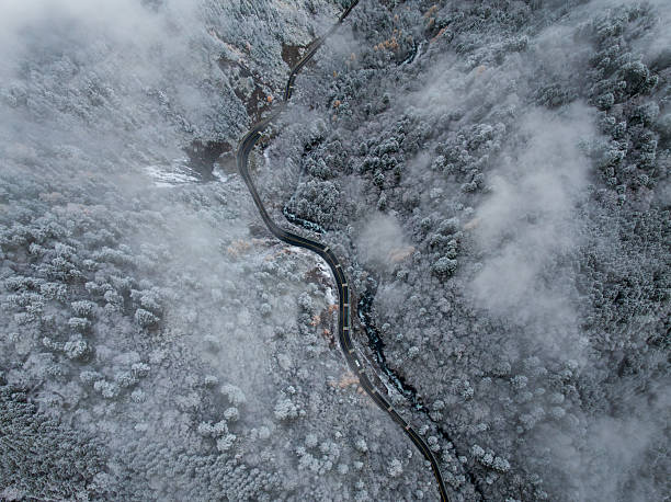 istock Misty Valley with Frosted Forest at Bipenggou 2247855873
