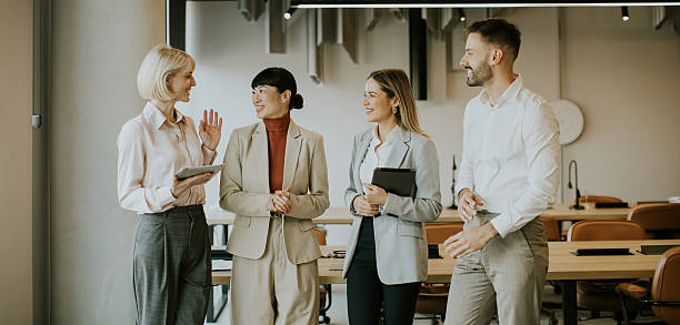 istock Business team discusses ideas in modern office space during daylight hours 2247856729