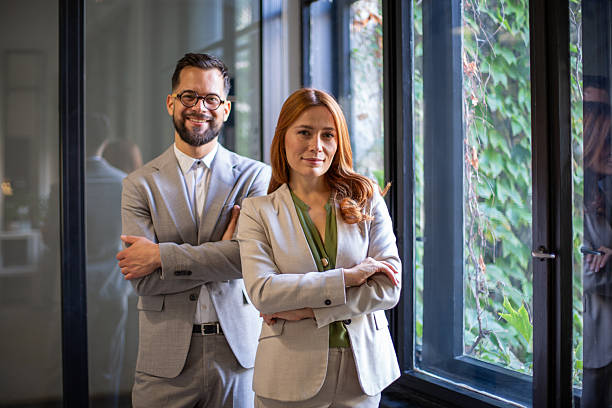 istock Business colleagues standing confidently with crossed arms 2247858681