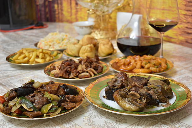 istock Braised beef, Chinese beef appetizers, fish and vegetable dishes, dumplings, red wine in decanter 2247861627