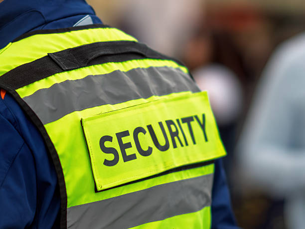istock Security Personnel Wearing Reflective Vest in Action 2247863302
