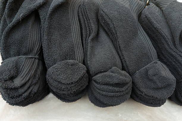 istock Stacks of clean black socks ready for use in a cozy home setting with soft texture and neat presentation 2247863833