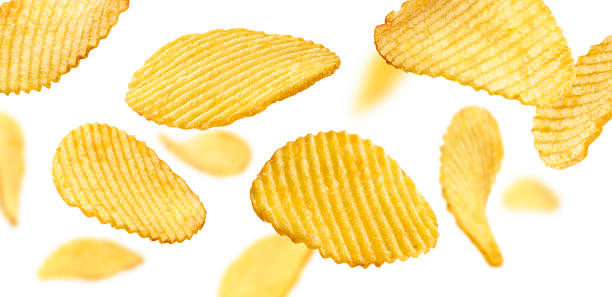 istock Fluted potato chips levitate on a white background 2247870350