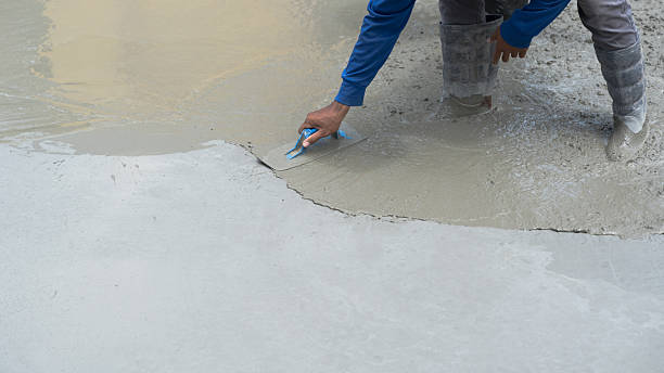 istock Hand worker polish rough concrete floor, Handle brush flooring cement stone background 2247871785