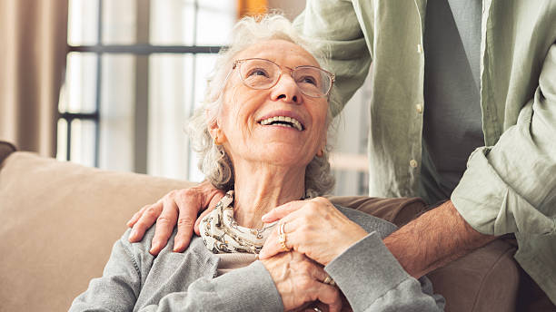 Comforting hand on shoulder of elderly person