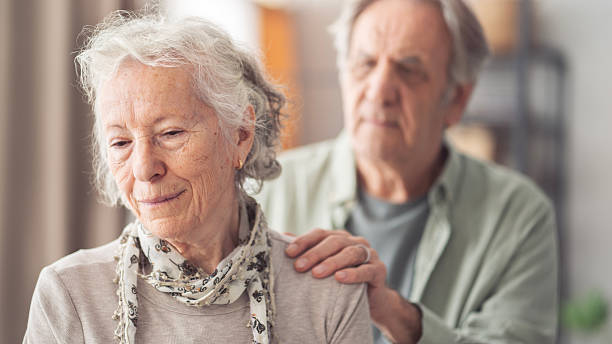 istock Depressed elderly woman receives support from husband 2247881354