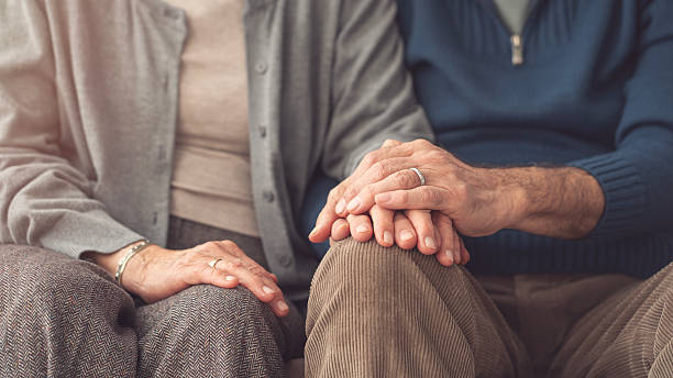 istock Elderly couple holding hands and supporting each other 2247881362