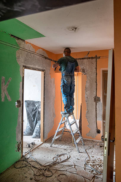 istock worker with jackhammer making new electricity. working on reconstruction of old apartment. 2247888234