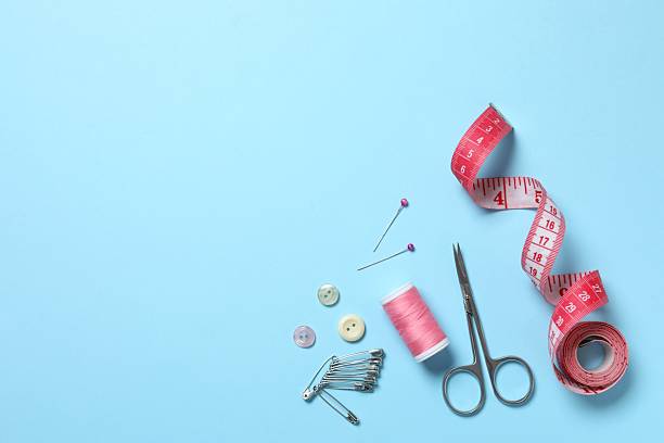 Flat lay composition with different sewing supplies on color background
