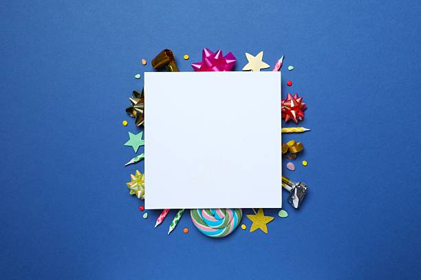 Happy birthday concept with paper card on blue background top-down copy space