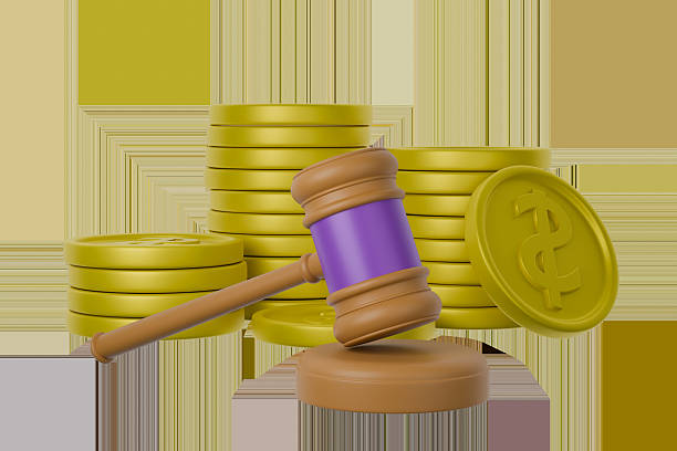 istock A gavel is depicted resting next to stacks of coins 2247892184