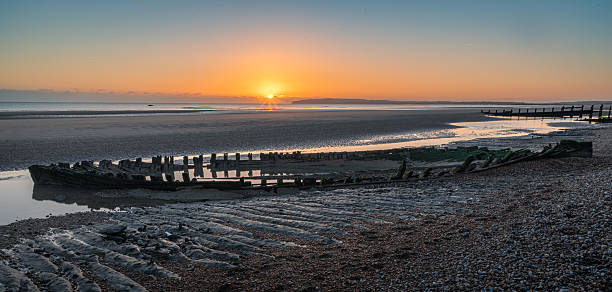 istock Broomhill sands shipwreck sunset 2247892651