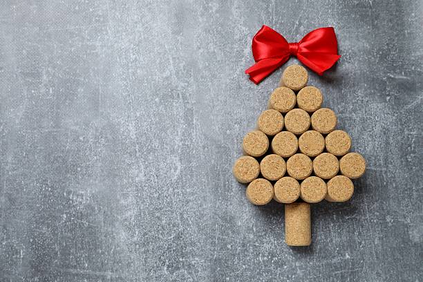 istock Christmas tree shaped wine corks on gray background. Top view with copy space for text 2247892797