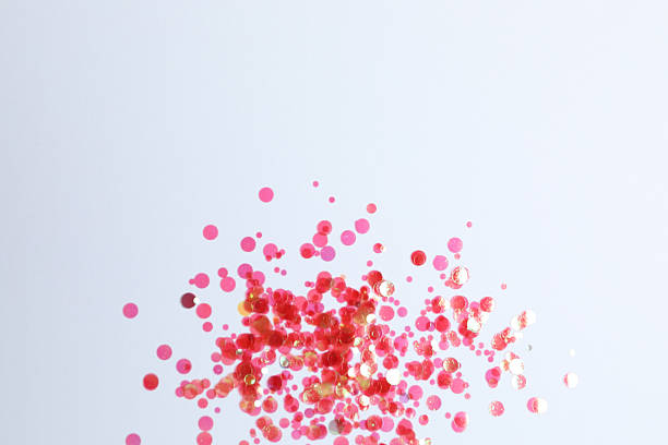 istock Pink confetti on a white background, top view 2247892891