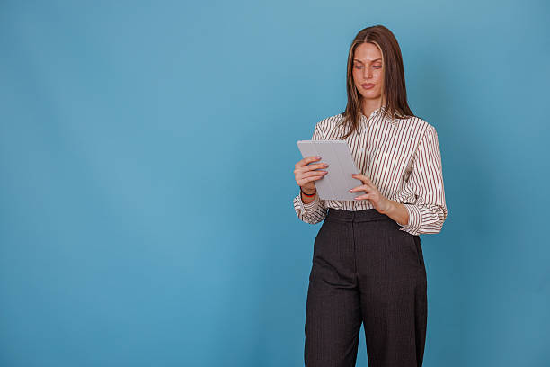 istock Focused young businesswoman using a digital tablet for online learning, remote working, and business communications 2247894578