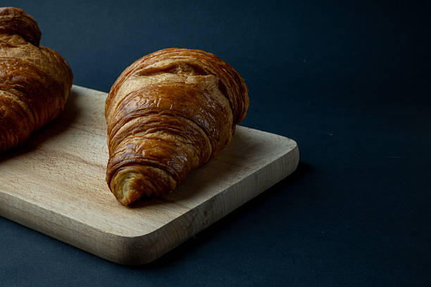 istock Fresh croissants and black background 2247894853