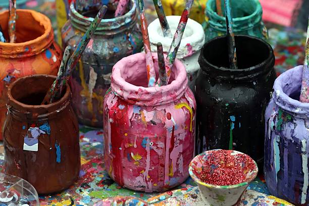 istock Ateliet bottler with paint and brushes 2247895589