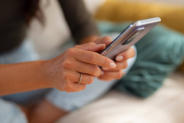 istock Woman hands holding using smartphone scrolling social media 2247895904