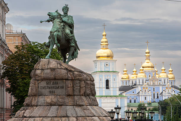istock Famous historic bronze monument to Bohdan Khmelnytsky stands on Sofia Square against the golden domes of St Michael's Monastery in Kyiv Ukraine creating a classic city landmark view 2247898344
