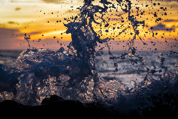Patterns of sea waves crashing against rocks.