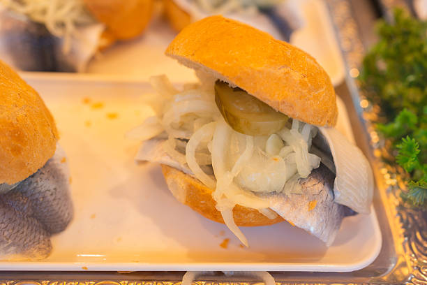 Preparing Swedish Smörgås Sandwich made with a Variety of Fresh Toppings like Smoked Fish and Roastbeef