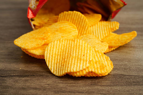 istock Potato chips in open bag, delicious BBQ seasoning spicy for crips, thin slice deep fried snack fast food. 2247906137