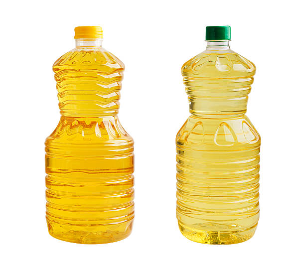istock Vegetable oil  in bottle isolated on white background. 2247906154