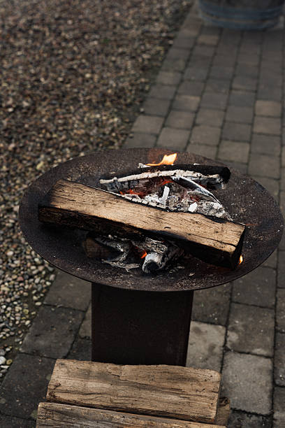 istock Glowing bonfire with burning logs and embers in a rustic fire pit, providing warmth and light during a chilly outdoor evening event. 2247906559