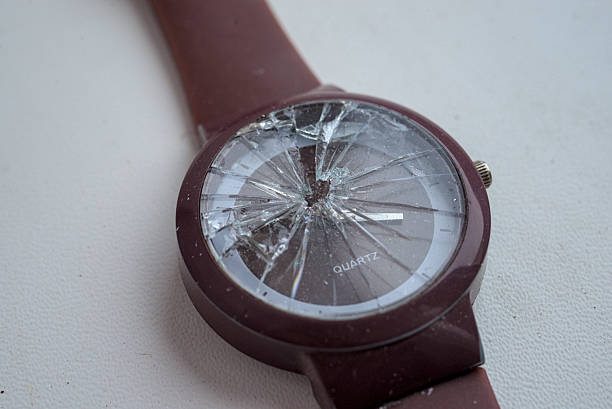 Hand watch with broken glass isolated