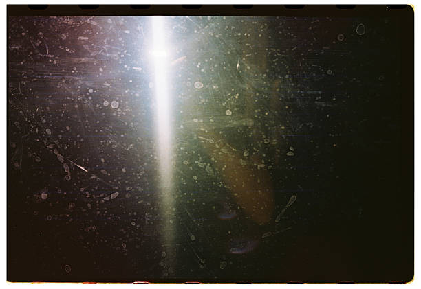 istock Dusty abstract surface with bright streak on analog film 2247910012